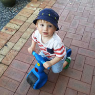 Riding his motorbike at Nanna's house