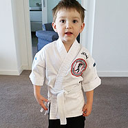 In his new karate outfit